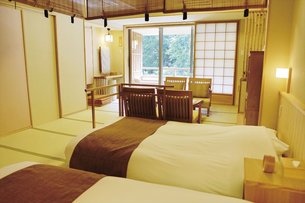 Inishie no Yado Ikyu_A serene, modern Japanese room with tatami floors and Japanese-style beds.