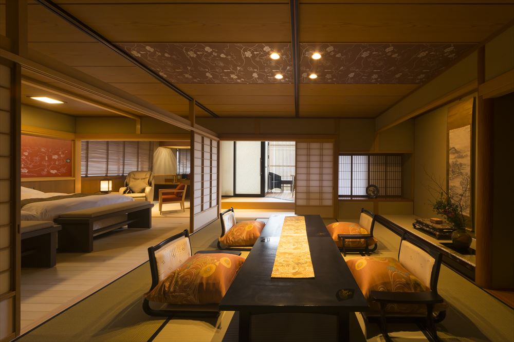 Tachibana Shikitei. Scarlet & Ultramarine ~ Premium Japanese-Western style room: a corner room with a Japanese style tatami space, a twin bedroom, dining area, and an open-air bath.