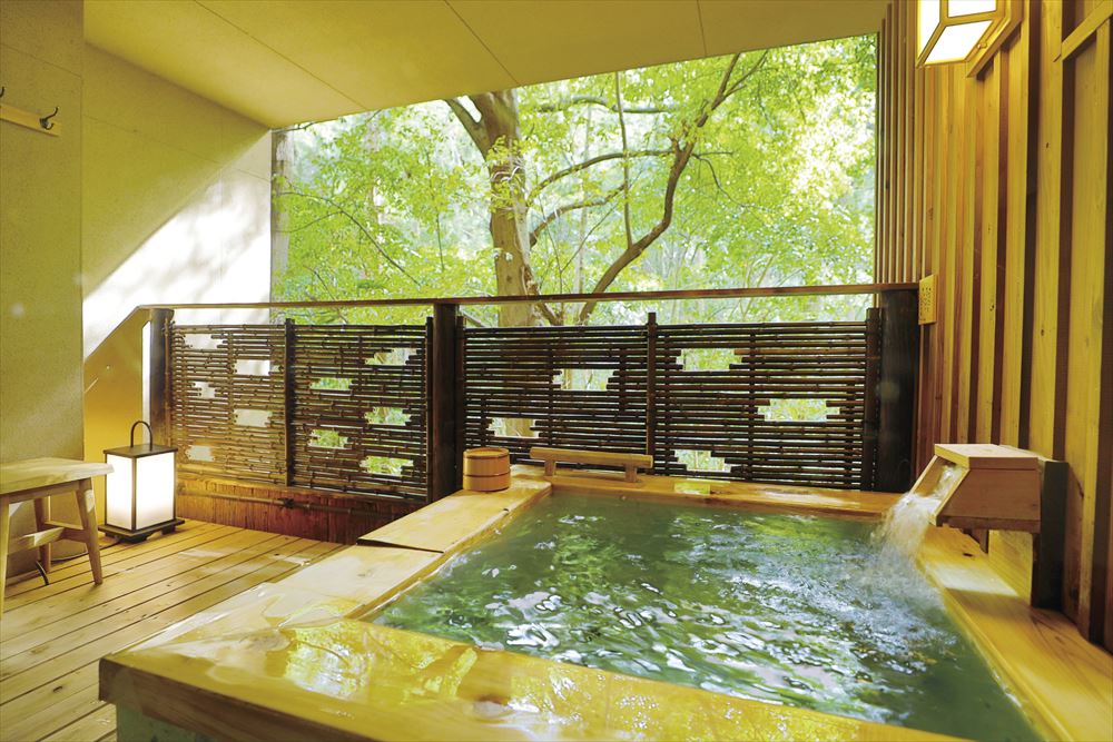 Inishie no Yado Ikyu_Open-air bath in guest room. Enjoy “forest bathing” and hot spring bathing at the same time amid the greenery of the grounds.