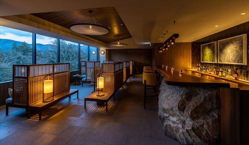 FUFU HAKONE JAPAN_Lobby. One of the distinct characteristics of Gora, where FUFU Hakone is located, is the rocky terrain. To reflect this environment, rock is woven into the interiors in dynamic ways that showcase its power and strength.