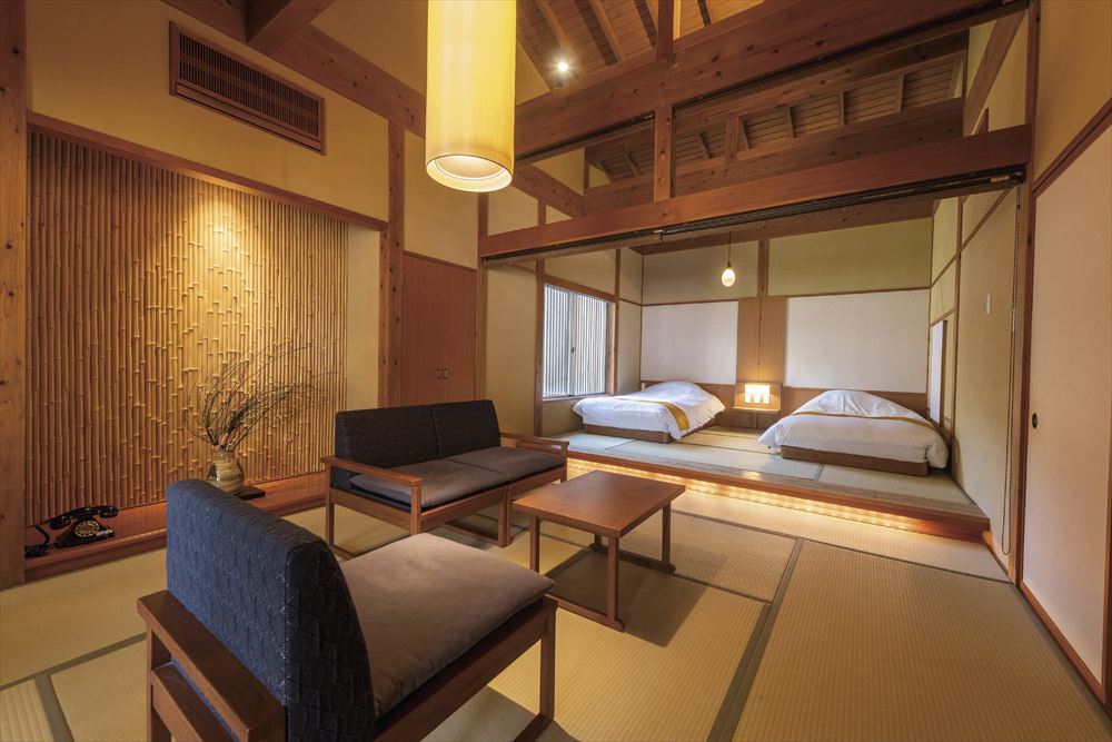 Yukairo Kikuya_Guest room in the “Soan” villa. High ceilings accentuate the sense of open space in the modern design.